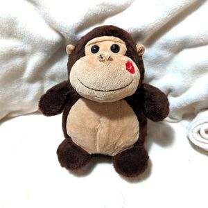 - Aurora Valentine plush Monkey with a squeaker that makes a kissing Sound.